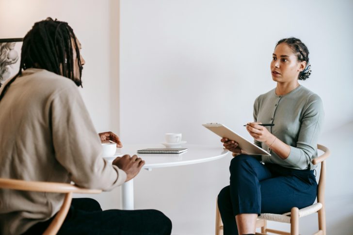 Photo by Alex Green: https://www.pexels.com/photo/ethnic-female-psychotherapist-listening-to-black-clients-explanation-5699479/