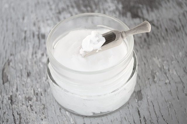coconut oil on wooden spoon, coconut oil in glass jar, black and white